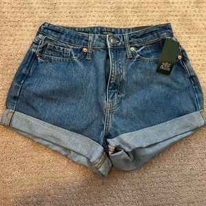 Jean shorts says “happy” on the back